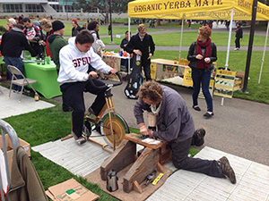 A photo of a bicycle-powered blender making a smoothie, from 2013.